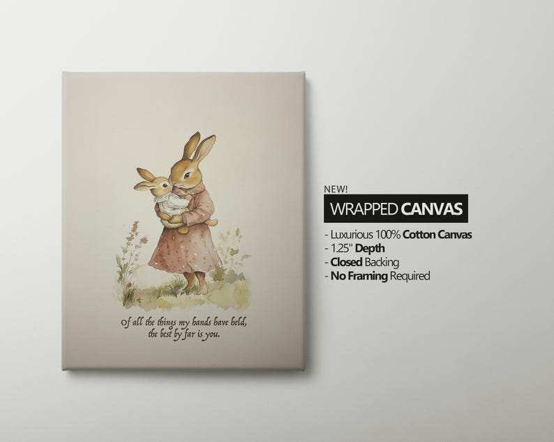 May include: Wrapped canvas art featuring a watercolor illustration of two rabbits. One rabbit is holding a smaller rabbit. The larger rabbit wears a pink dress. Text on the canvas reads, "Of all the things my hands have held, the best by far is you."
