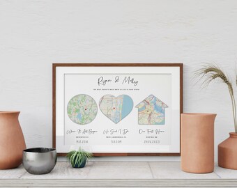 Può includere: Una stampa incorniciata con i nomi Ryan & Molly, il testo The best thing to hold onto in life is each other e tre mappe a forma di cerchio, cuore e casa. Sotto sono riportate le etichette Where It All Began, We Said I Do e Our First Home.