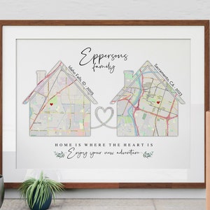 May include: A framed print with a map of Idaho Falls, ID and Sacramento, CA, with a heart connecting the two locations. The text "Eppersons Family" is at the top of the print, and the text "HOME IS WHERE THE HEART IS Enjoying your new adventure" is at the bottom.