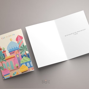 May include: A colourful card with an illustration of a mosque and the text "Eid Mubarak". The card is folded in half and the inside is blank.