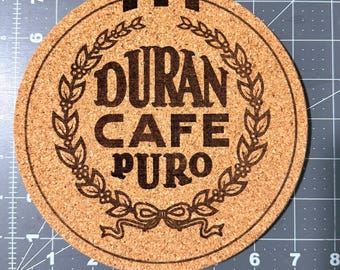 Sottopentola riscaldanti in sughero Duran di Panama Cafe, set da 2 pezzi.