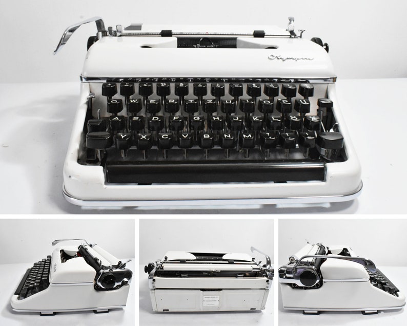 May include: A vintage white typewriter with black keys and chrome accents. The typewriter has a classic design with a carriage return lever and a paper feed mechanism. The word "Signature" is visible on the front of the typewriter.