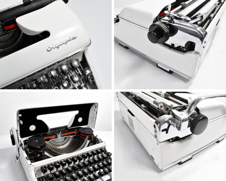 May include: A white Olympia typewriter with black keys and chrome accents. The typewriter has a classic design with a carriage return lever and a paper feed mechanism. The Olympia logo is visible on the front.