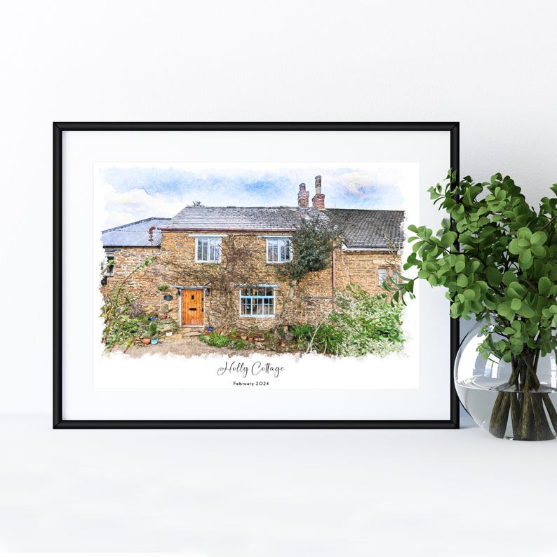May include: Framed watercolor print of a stone cottage with a brown door and climbing vines. The print is titled "Holly Cottage" and dated February 2024. The artwork is displayed in a black frame.