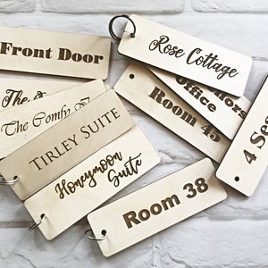 Custom Hotel / Business Wooden Key Fobs - Engraved Wood Key Tags in Poplar finish.  Ideal for home, hotel, office or any building