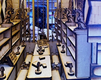 May include: A wooden model of a room with a large window, bookshelves, and a table with chairs. The room is decorated with dragon statues and the text "DRACO DORMIENS NUNQUAM TITTILANDUS" is written above the window.
