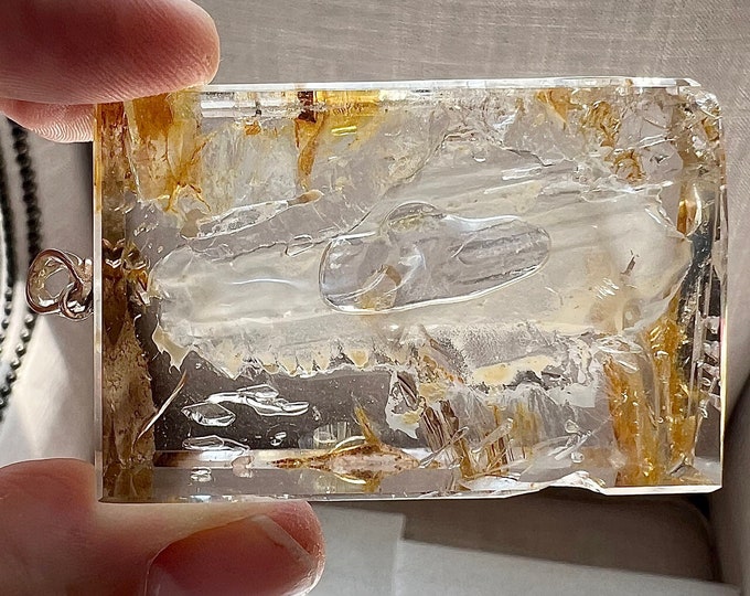 Specialty Enhydro - thin milky sediment and extra-large moving bubble - nice combination - silver pendant