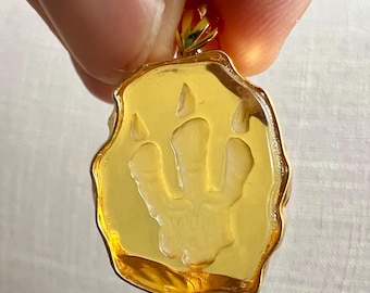 Amber pendant - highly detailed amber carving of a dinosaur T-Rex footprint- IDA0626