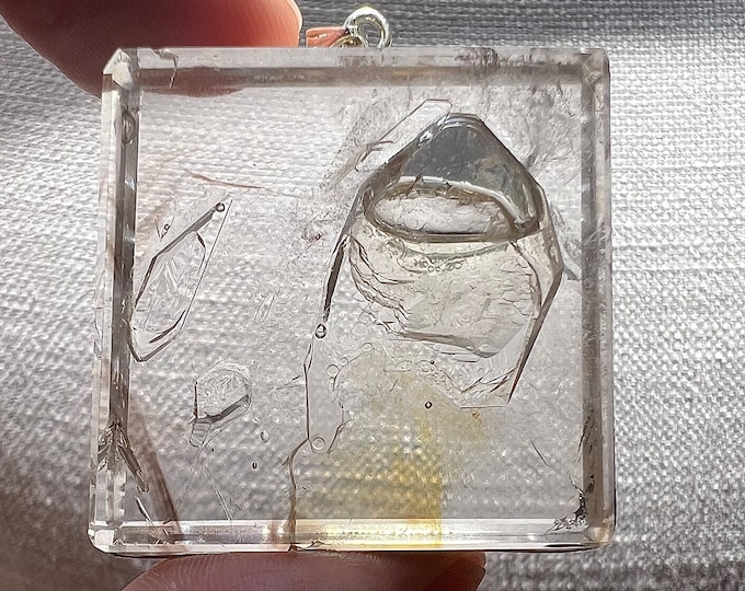 Fascinating Enhydro with large moving bubble and UV reactive oil in crystal shape cavity - elegant quartz rock crystal pendant with chain