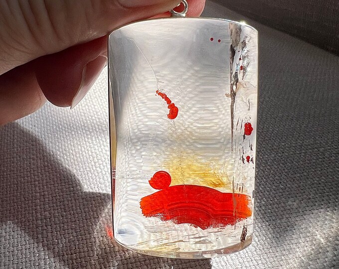 Inclusion - Exceptional Quartz rock crystal with red and yellow hematite and iron oxide inclusion - unique pendant ID A0362