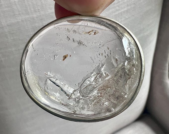 Enhydro pendant 2 large bubbles - Polished quartz rock crystal specimen with 2 enhydro bubble inclusions, set in silver pendant IDA0609