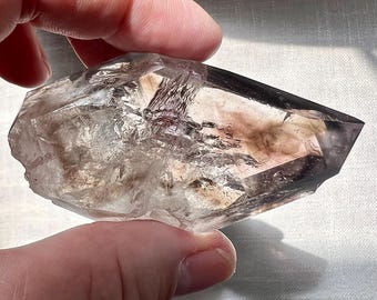 Smoky quartz enhydro with moving bubble and mica flakes 3 phase - unmounted quartz rock crystal polished specimen ID A0566