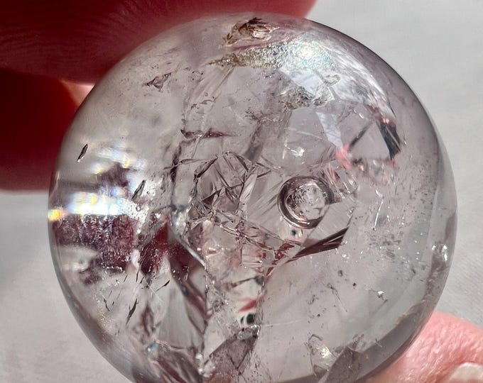 Enhydro - quartz rock crystal shaped as a sphere ball with a moving bubble - phantom and superb internal crystal formation - ID A0448