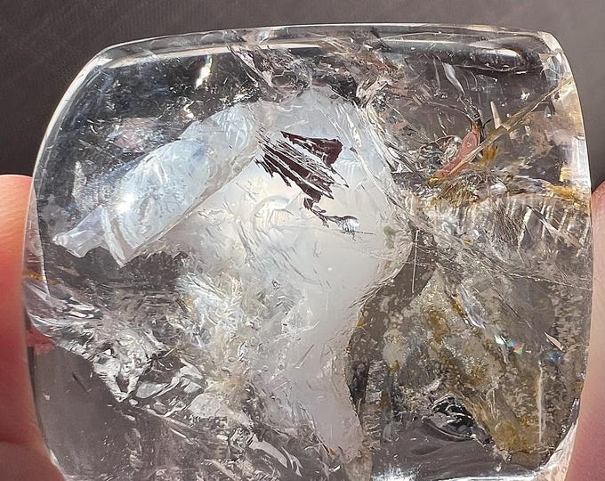 Enhydro bubble - unmounted quartz rock crystal with moving bubble in uncommon, frosted cavity - ID A0559