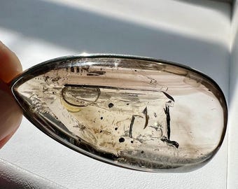 Enhydro silver pendant with a large moving bubble, hematite inclusion and UV reactive substance - quartz rock crystal - ID A0670