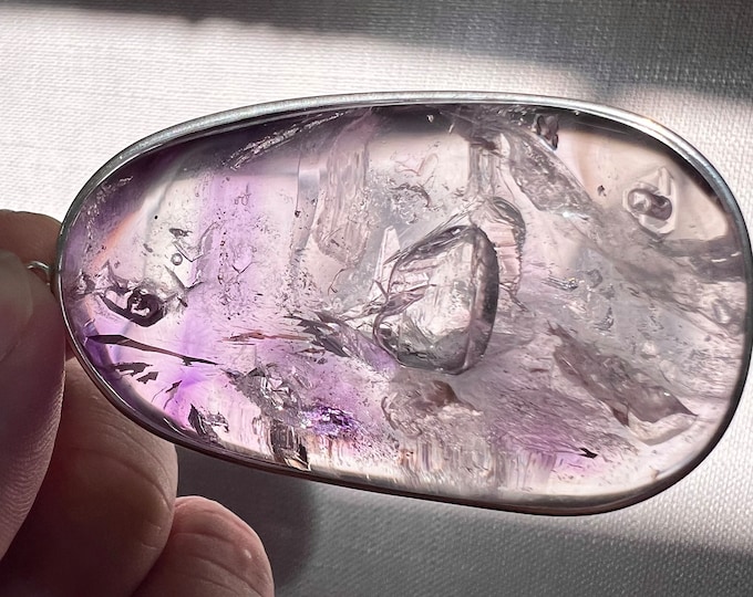 Enhydro amethyst pendant with 5 bubbles - impressive clear quartz with internal amethyst vail with multiple enhydro inclusions ID A0337
