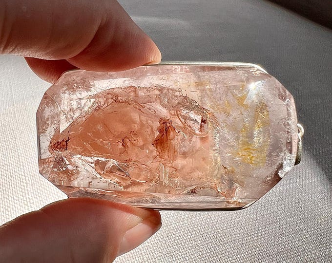 Specialty Enhydro - Rare combo, quartz rock crystal pendant with a large moving bubble and red hematite flakes - ID A0389