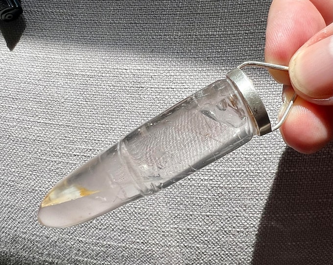 Enhydro pendant - Bullet shaped quartz rock crystal carving with moving enhydro bubble inclusion -
