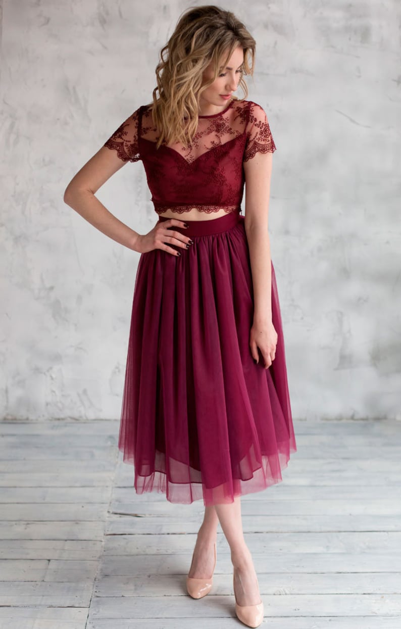 Fluffy tutu burgundy tulle skirt. Midi length, waist fit. Has a sewn-in waistband about two inches wide. Sewn from several layers of soft tulle, lined with chiffon. Very flowy and airy.
