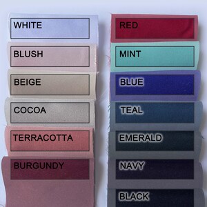 May include: Color map of polished cotton fabric swatches from Renie Boutique. Colors include white, blush, beige, cocoa, terracotta, burgundy, red, mint, blue, teal, emerald, navy, and black.