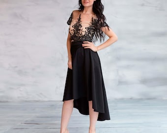 Falda elegante negra asimétrica de cintura alta