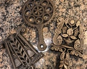 Three Cast Iron Unmarked Trivets