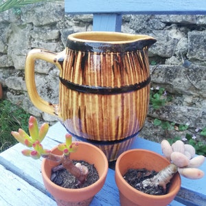 Barrel-shaped glazed terracotta pitcher