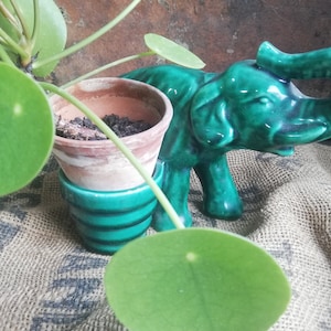 Zoomorphic barbotin, elephant and its little pot