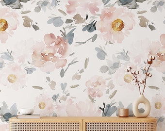 May include: A light wood cabinet with four woven rattan doors. The cabinet is in front of a wall with a watercolour floral wallpaper featuring pink and grey flowers.