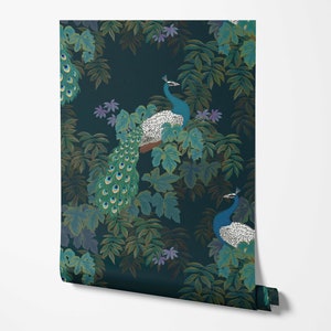 May include: Wallpaper roll featuring a dark teal background with a repeating pattern of peacocks and foliage. The peacocks have blue and white plumage with long, green and blue tail feathers. The leaves are various shades of green and brown.