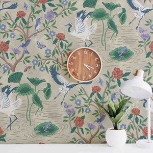May include: A beige wallpaper with a repeating pattern of cranes, flowers, and leaves. The wallpaper has a vintage aesthetic and features a muted colour palette of green, blue, red, and white.