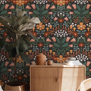 May include: A dark green, orange, and pink floral wallpaper pattern with a woven wood cabinet and a potted plant in a woven basket.