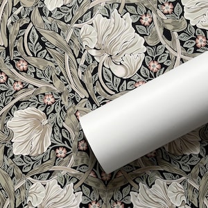 May include: A repeating pattern of stylized flowers and leaves in shades of green, white, and pink on a black background. The design is reminiscent of Art Nouveau style.