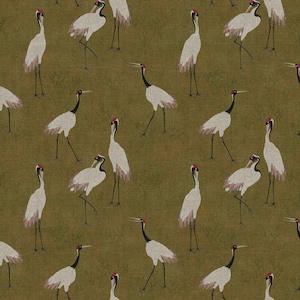 May include: A repeating pattern of white cranes with black necks and red crowns on a textured olive green background. The cranes are depicted in various poses, creating a sense of movement and natural elegance. This design is suitable for fabric or wallpaper.