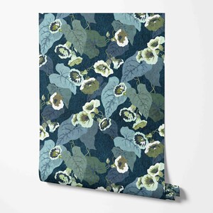 May include: A blue and green floral wallpaper with a repeating pattern of stylized flowers and leaves.