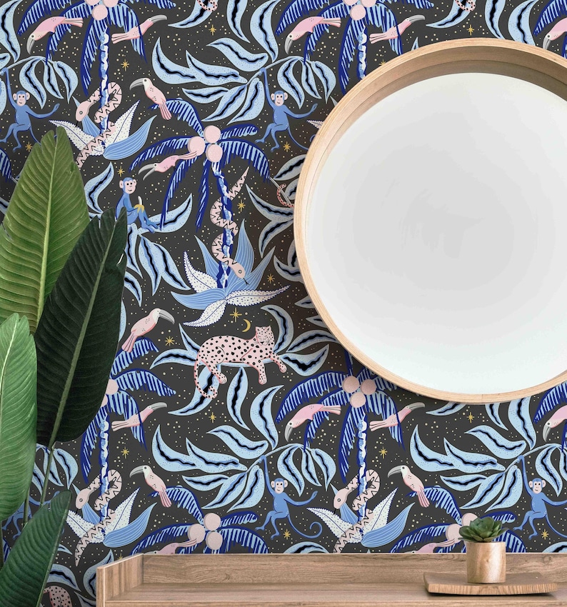 May include: A dark gray wallpaper with a repeating pattern of blue and white palm trees, pink toucans, monkeys, snakes, and leopards. The wallpaper is accented with gold stars and a crescent moon.
