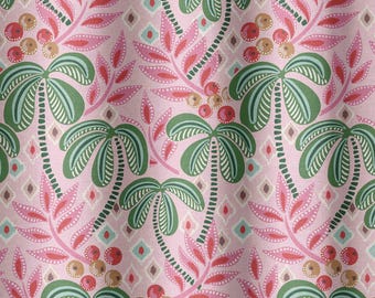 May include: A pink fabric with a repeating pattern of green palm trees, pink and red leaves, and brown and red berries.