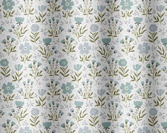 May include: White fabric with a repeating floral pattern. The design features light blue flowers, green stems, and small gray leaves. The overall aesthetic is soft and delicate, suitable for home decor.