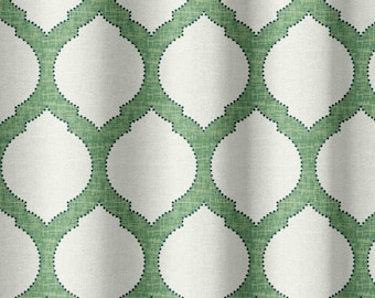 May include: A white fabric with a green geometric pattern. The pattern is made up of repeating circles with a textured, woven look.
