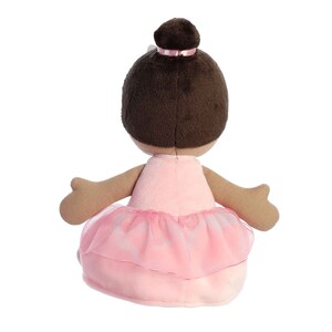 May include: A plush ballerina doll with brown hair, wearing a pink tutu and a white headband with a pink bow.