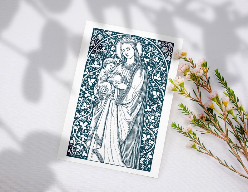 May include: A black and white illustration of the Virgin Mary holding a baby Jesus. The image is surrounded by a decorative border of leaves and flowers.