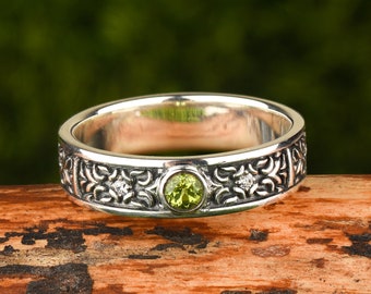 Sterling silver gemstone peridot ring in celtic style as engagement ring or wedding band for men and women: unique art deco statement ring