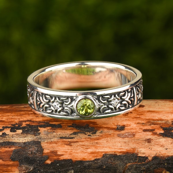 Sterling silver gemstone peridot ring in celtic style as engagement ring or wedding band for men and women: unique art deco statement ring