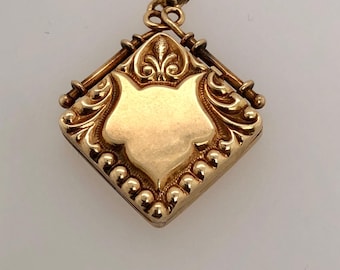 Victorian 14k Yellow Gold Locket Necklace: Repoussé Scrollwork Pendant