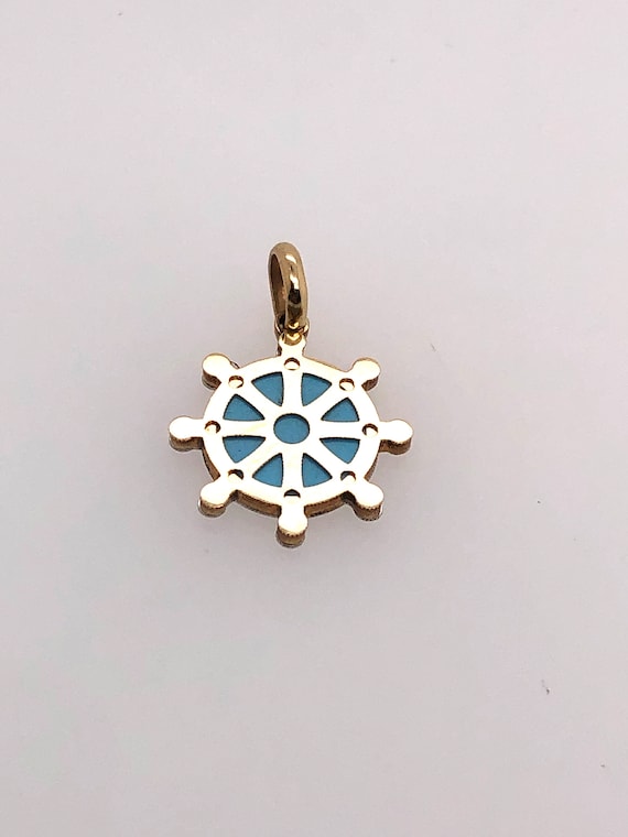 ship helm charm with turquoise colored stone