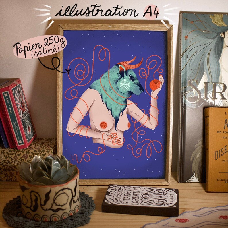 May include: A framed illustration of a woman with a bull's head, holding a red apple. The illustration is on a blue background with red string-like lines. The frame is made of wood and has a white mat. The text "illustration A4" is written in black at the top of the frame. The text "Papier 250g (satin&eacute;)" is written in black at the top left of the frame.