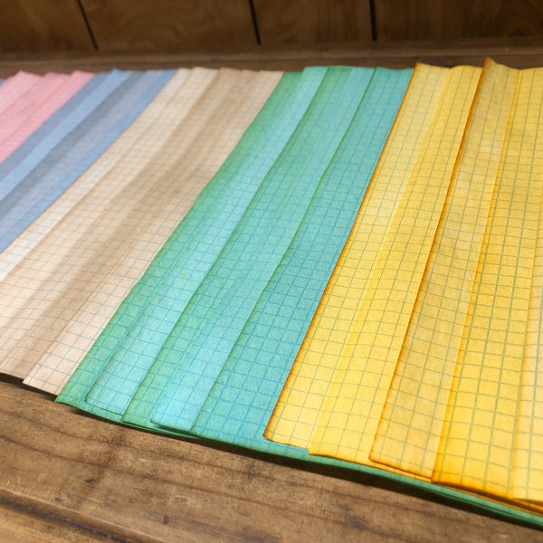 30 Sheets of Multicolored Tea Dyed 8.5 x 11’ Double-sided Graph Paper.