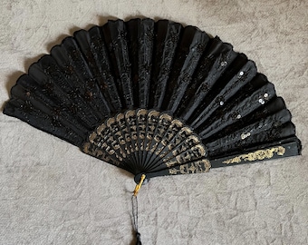 Antique black hand fan