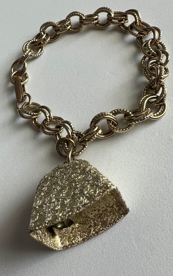 Sweet 1951 gold-tone chain bracelet with a bell an