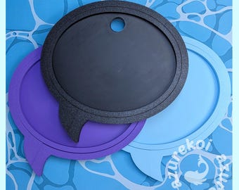 May include: Three circular speech bubble signs in black, purple, and light blue. Each sign features a small triangular tail and a circular cutout at the top. The text "azurekoi" is printed in white in the bottom right corner of the light blue sign.